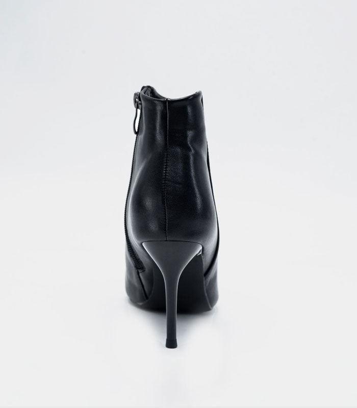 Back Side view of Chelsea - Black ankle boots with a stylish and sleek design