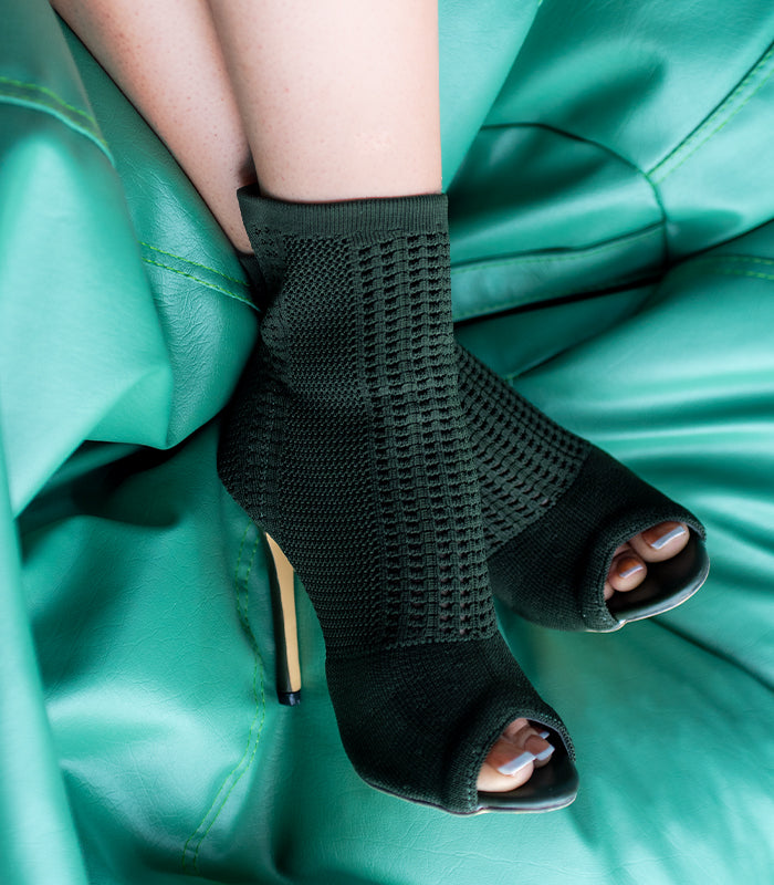 Stylish green ankle boot 'RIRI 2.0' with a striking open-toe and stretchy sock material by Rayseen