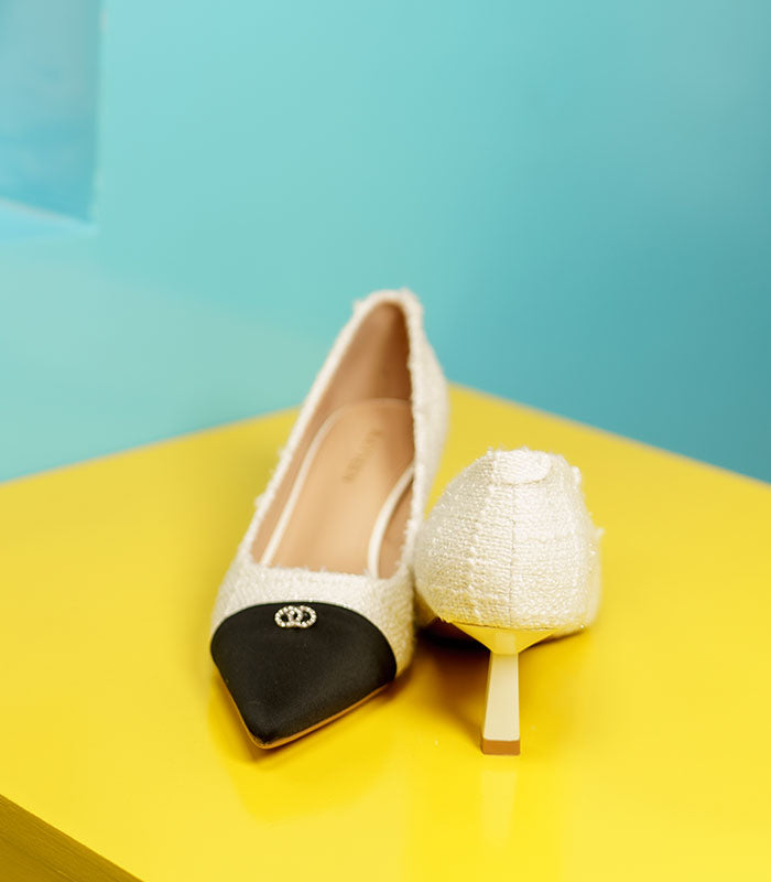 High-quality beige shoes with white tweed fabric, black accents, and comfortable Pillows insoles