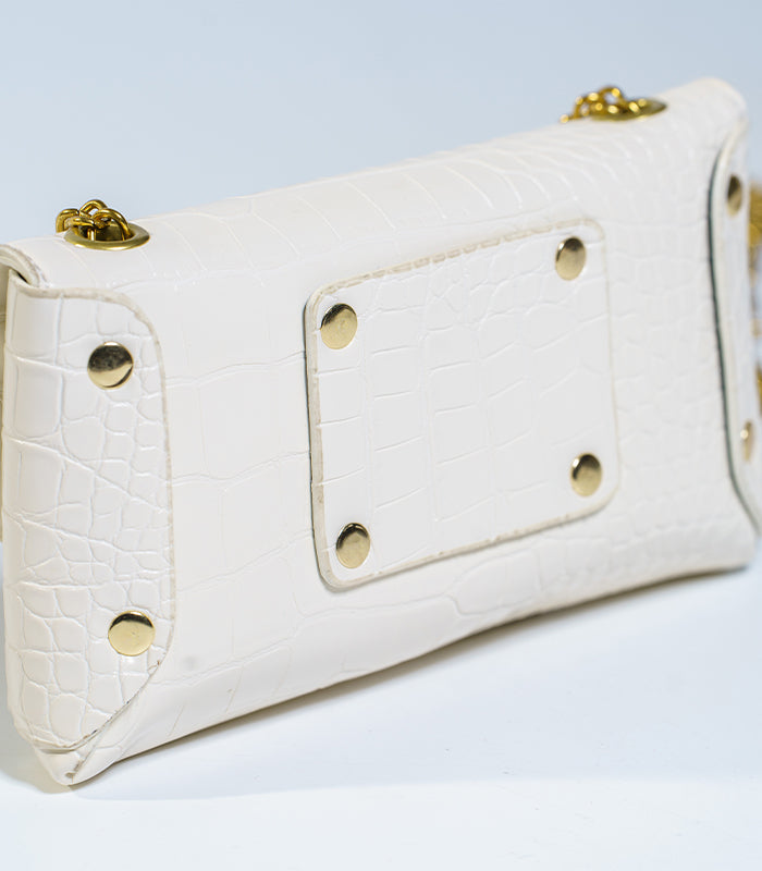 Side view of Gianni mini bag, a perfect accessory for day or night with its lovely white hue